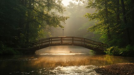 Fototapeta premium A bridge over a river with a foggy morning
