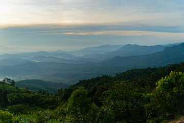 Fototapeta premium Morning in the mountains. The birth of clouds. The fog rises and forms cirrus clouds in the sky. The highlands near Dalat in Vietnam.