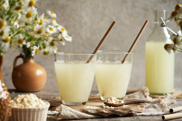 Two glasses of fresh whey on a table