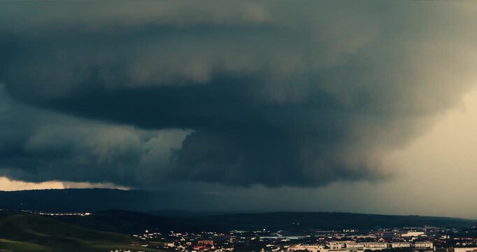 Extreme weather, supercell storm clouds over Cluj city, dramatic huge tornado
