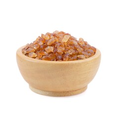 Rock sugar in wooden bowl close up on white background.