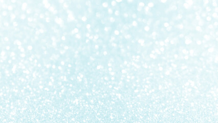 Blue pastel bokeh glitter light sparkle background. Snowfall, Winter, New Year, Christmas and Celebration backgrounds concepts. Abstract blue background with snowflakes.