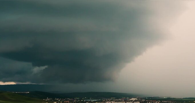 Extreme weather, supercell storm clouds over Cluj city, dramatic huge tornado