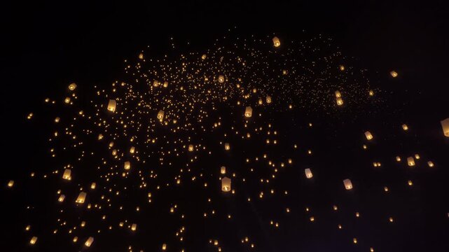 Thai people release sky floating lanterns or lamp to worship Buddha's relics at night. Traditional festival in Chiang mai, Thailand. Loy krathong