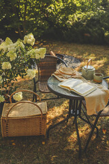 Bible on table in garden, morning prayer and worship