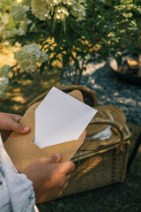 Girl holding a letter in her hands, summer mood
