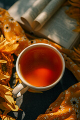 A cup of tea, a book and sunflowers, a summer mood