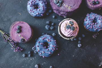 Colorful cakes on a dark background, beautiful picture