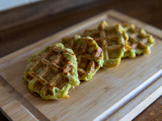 Zucchini waffles on a wooden board