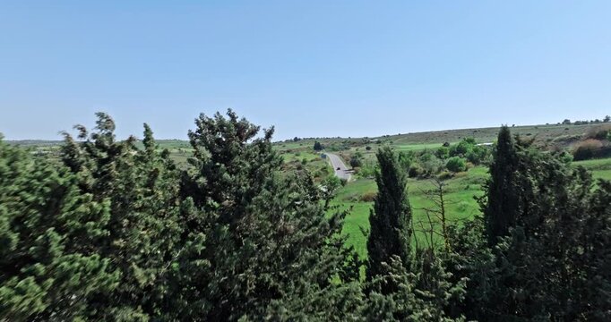 Aerial view of a road in the mountains of Cyprus. Countryside travel by car on the island of tourism. High quality 4k footage