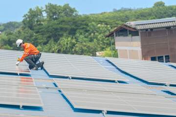 Worker Technicians are working to construct solar panels system on roof. Installing solar photovoltaic panel system. Men technicians walking on roof structure to check photovoltaic solar modules.