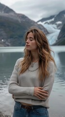 Woman with eyes closed in front of a lake and mountains. AI.