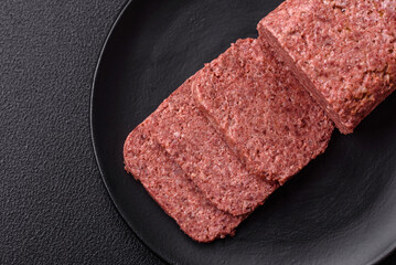 Delicious canned pink ham with salt, spices and herbs