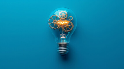 Light bulb with gears inside on a blue background, conceptual innovation and creativity