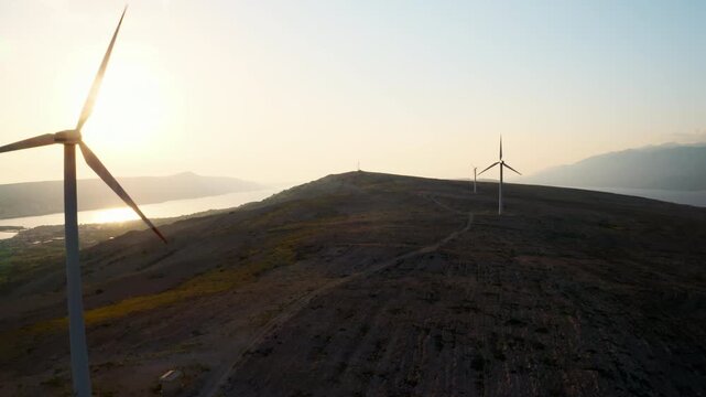 Modern wind turbines rotate generating clean energy on Pag Island. Innovative solution provides cost-effectiveness of wind energy in Croatia