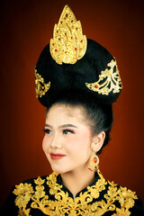 young asian women wearing makeup, wearing batik clothes and Indonesian cultural attributes