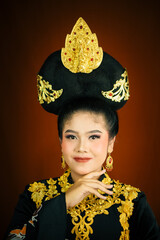 young asian women wearing makeup, wearing batik clothes and Indonesian cultural attributes