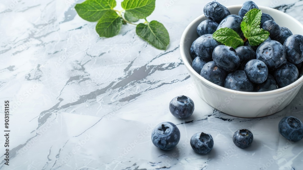 Poster Fresh blueberries on marble table top view with text space