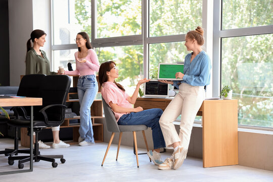 Team of female programmers working in office