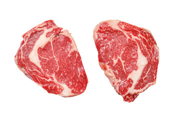 Raw ribeye steaks with savory spices