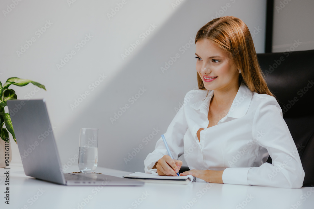 Canvas Prints Woman Working on Laptop in Office