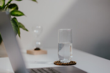 Glass of Water on Desk with Laptop