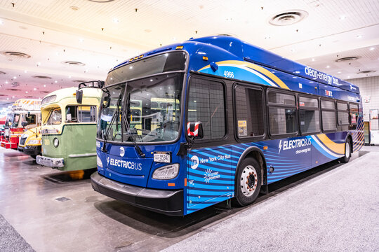 New York City, USA - March 27, 2024: MTA New Flyer Xcelsior XD60 electric bus at New York International Auto Show in a row, corner view