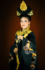 young asian women wearing makeup, wearing batik clothes and Indonesian cultural attributes