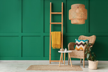 Interior of living room with wooden ladder, wicker armchair and table