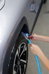 Washing car, cleaning tires and wheels