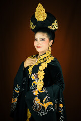 young asian women wearing makeup, wearing batik clothes and Indonesian cultural attributes