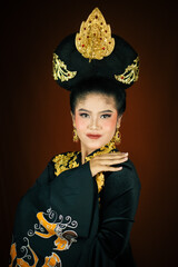 young asian women wearing makeup, wearing batik clothes and Indonesian cultural attributes