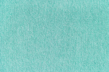 Closeup, macro of turquoise jeans denim fabric texture background, cloth with diagonal weawing