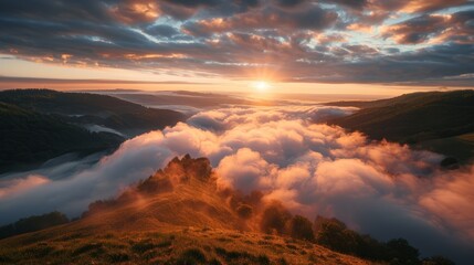 Golden sunrise over misty hilltops in a serene landscape