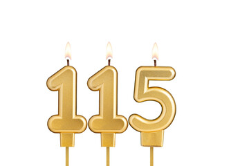 Golden number 115 birthday candle on white background