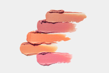 Palette of make-up foundation for different skin colors isolated on grey background