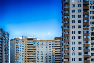 Fototapeta premium Winter moon over building