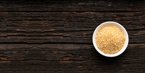 Organic dried sesame seeds in the bowl - Sesamum indicum