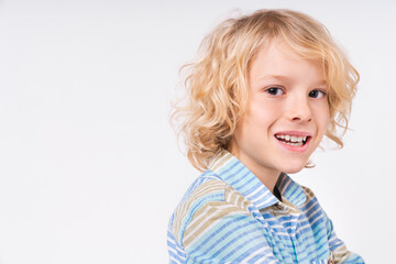 Side view portrait of caucasian little small preteen boy male child kid elementary primary middle school pupil teenager isolated over white background copy space. Dentistry stomatology concept