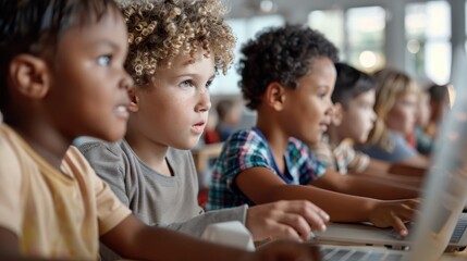 Obraz premium Young children in a classroom setting, each engaged with their laptops, showcasing the integration of technology in education and fostering learning and concentration.
