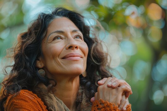 Middle age hispanic woman smiling confident looking to the sky at park