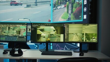 Public security headquarters equipped with satellite CCTV system, monitoring traffic via live radar...