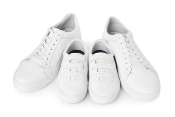 Big and small sneakers isolated on white
