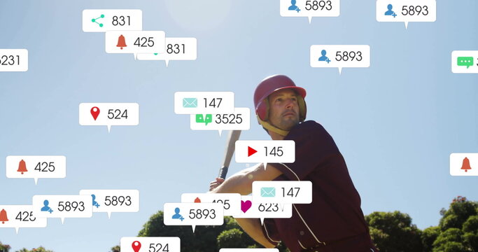 Image of social media icons with growing numbers over caucasian male baseball player - Powered by Adobe
