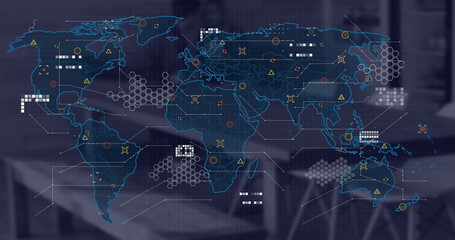 Image of financial data processing and world map over desk in office