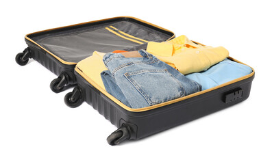 Open suitcase with clothes packed for travelling isolated on white