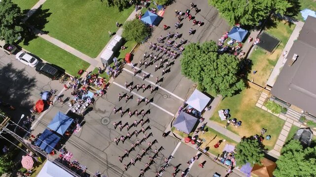 Aerial shot of parade on neighborhood street - drone shot