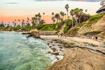 Laguna Beach ocean shoreline with palm trees at Treasure Island Park, Orange County, California USA