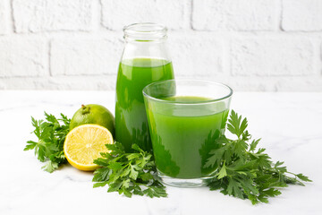 Green healthy detox, lemon and parsley juice. Green vegetable smoothie