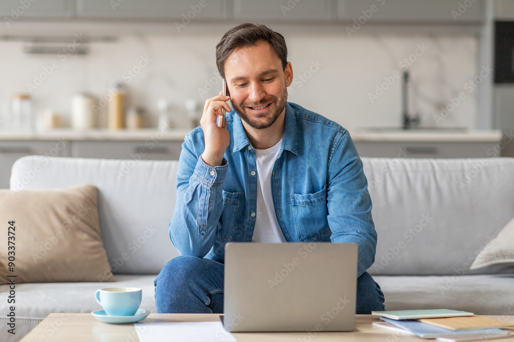 Aufkleber a man sits on a couch in a living room, using a laptop and talking on a mobile phone. he has a relax